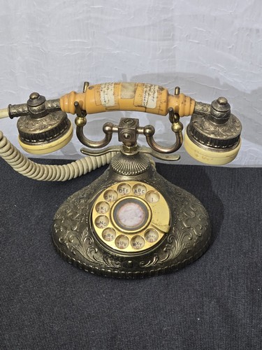 Vintage ornate metal rotary - ornate,