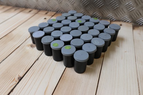 Empty 35mm film canisters - empty,