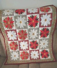 Handmade patchwork christnas poinsettia quilt with machine Appliqued design