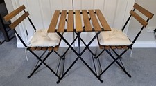 IKEA Tarno Black brown Garden Bistro Set Table, 2 Chairs and 2 cream cushions. 