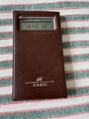 Casio calculator - ~,