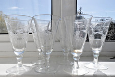 Six engraved glass flutes or