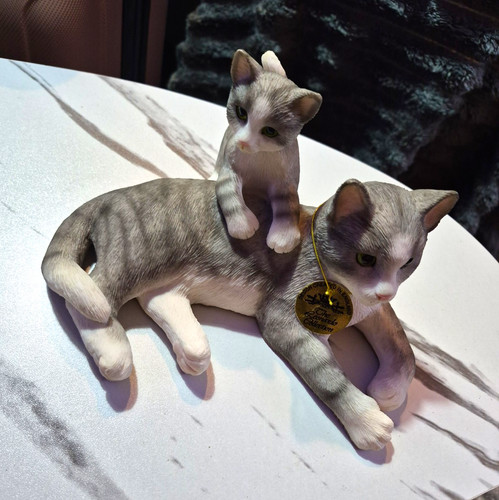 Leonardo tabby cat with - with, kitten