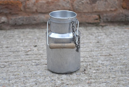 Vintage old aluminium milk