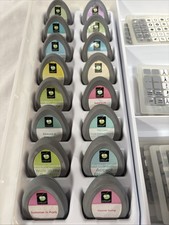 Lot of 16 Cricut Cartridges with overlays in a plastic storage case