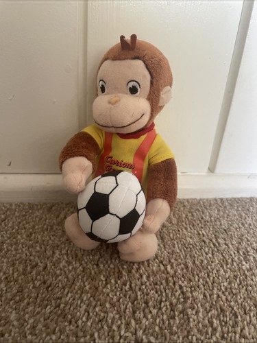 Curious george plush holding - george,