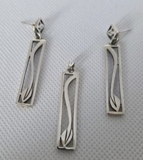 Charles Rennie Mackintosh style sterling silver earrings and pendant set.
