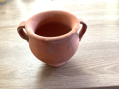 Round terracotta urn feat twin - urn,