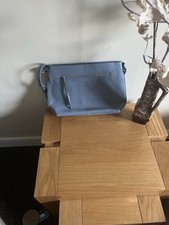 Lloyd Baker Leather Crossbody Bag. Light Blue with Orange Lining