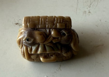 Antique Mystical beast Japanese netsuke finely carved from tagua nut