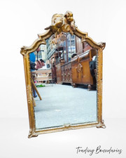 Cherub-topped gilt-framed