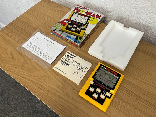 Grandstand pocket pacman 1983 - grandstand,