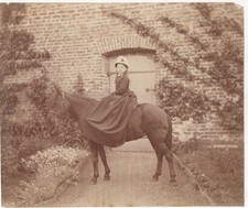Young Woman Riding Horse