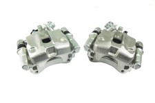 2 REAR BRAKE CALIPERS CARRIER