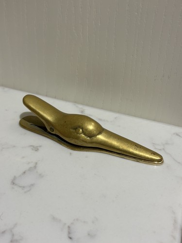 Vintage brass duck paper clip - paper,