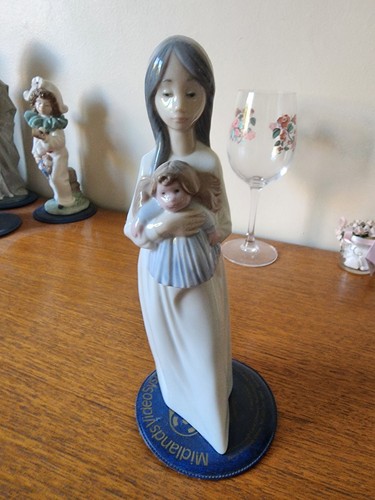 Nao girl holding doll - nao,