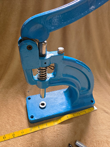 Blue hand press - hand, eyelet/grommet
