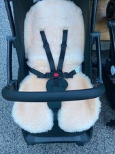 Sheepskin like stroller seat