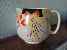 LARGE PALE YELLOW CROWN DEVON JUG with HAND PAINTED FLOWERS approx 4.5" height