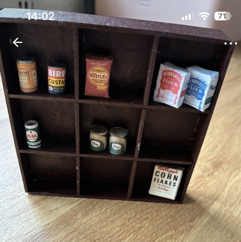 Dolls house shelving with - dolls,