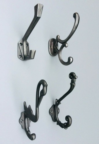 Antique cast iron coat hooks - cast,