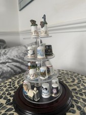 21 thimbles On Plastic Shelves