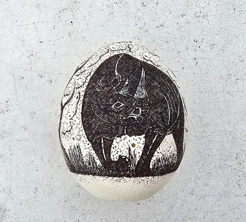Etched rhinosaurus ostrich egg - etched,