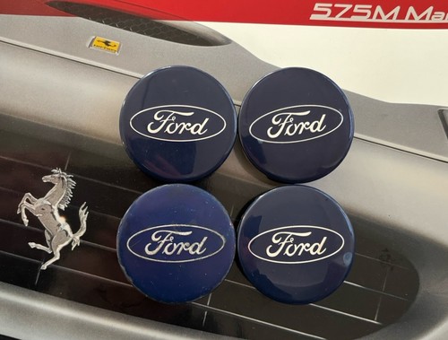 Four genuine ford centre wheel - four,
