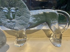 2 x Kosta Boda lion and a glass paperweight by Mats Johansson