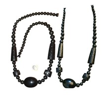 Two 1960s Plastic Carved Black