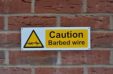CAUTION BARBED WIRE plastic