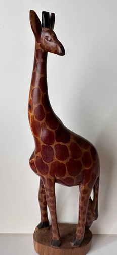 Hand carved wooden giraffe - hand,