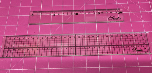 Plastic ruler with metal edge