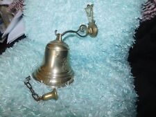 VINTAGE BRASS WALL MOUNTED BELL WITH RAISED CHERUB DESIGN LONG CHAIN CLANGER