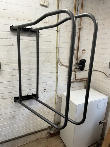 Arm swinging rug rack - swinging,