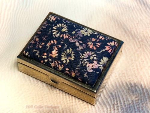 Black and silver fabric topped