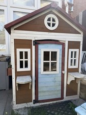 This Outsunny Wooden Playhouse