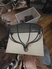black wrought iron wall shelf