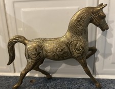 a copper or bronze horse