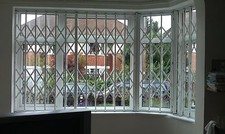 RETRACTABLE SECURITY GRILLE, SECURITY GRILLS, WINDOW GRILLES, DOOR GRILLES, 