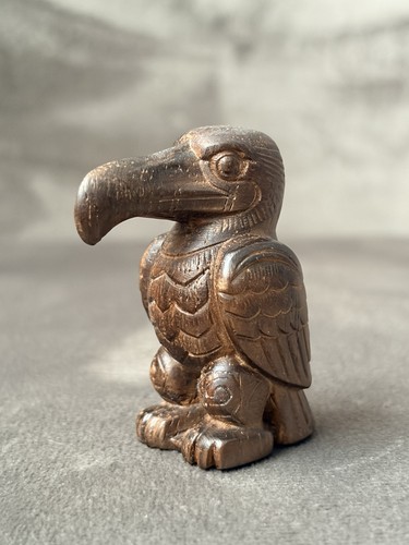 Hand carved wooden puffin - hand,