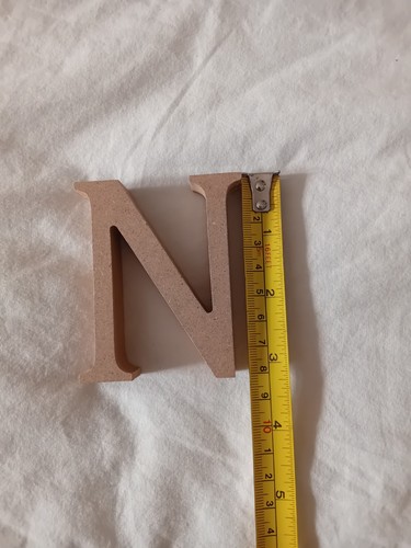 Freestanding wooden letter - freestanding, n