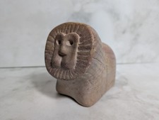Carved stone lion sculpture