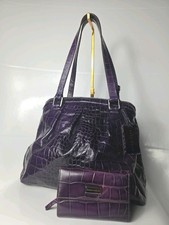 Coccinelle purple leather handbag with a matching wallet.