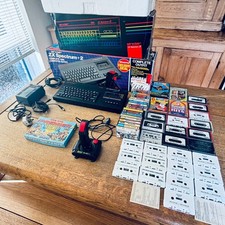 Sinclair 128K ZX spectrum +2A computer with multiple games, joystick & packaging