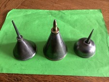 Three Conical Oil Cans with