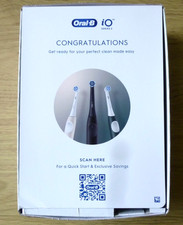 Oral-B iO2 Rechargeable Toothbrush, with case and brush head. Black. Box opened.