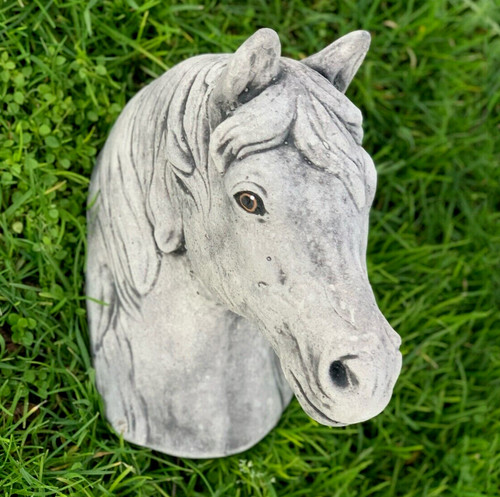Concrete horse head sculpture