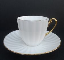 An exquisite Shelley white & gold Ludlow shape demitasse cup & saucer. C.1940+.
