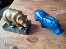 2 Animal carvings. Brass bear on marble base and blue resin hippopotamus
